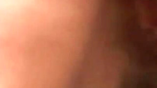Redhead sucks two cocks in threesome and gets a warm load on her tits