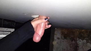 Gf jerking a hot cock at the glory hole