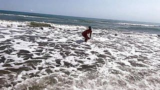 Dominant woman having fun on the beach