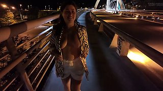 Luscious Milf walks without Bra and Panties on the Bridge