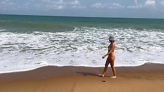 A Busty Blonde Is Walking and Sunbathing Naked