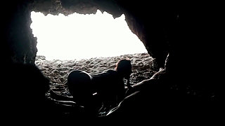Couple recorded at the beach, inside the cave