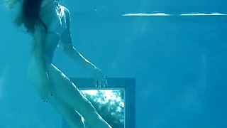 Beautiful Redhead's Playful Charm by the Poolside