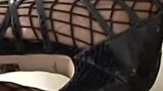 Black Slut in Fishnet Stockings and Big Tits Fucked by a Huge Black Cock