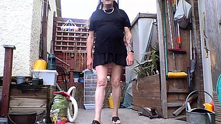 Me walking in maids outfit in garden