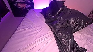 Girl in Garbage Bag Plays with Breath