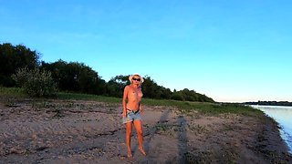 Russian Nudist on the River Shore