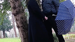 Muslim woman plays and blows a large cock outside in the park
