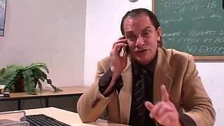 Tattooed dark haired in a classroom with cumshot