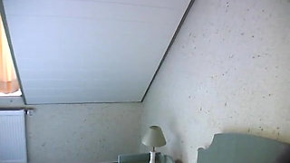 Horny girl lays in bed finger fucking herself and stroking clit