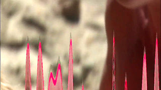 She Lies Naked on the Beach While He Watches Her