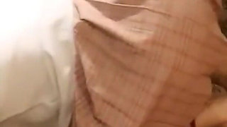 A Cute Little Dressed in a Jk Uniform Was Walking Around Barefoot on the Ground.