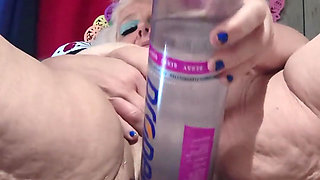 Big Bottle Plugged Clit Cunt