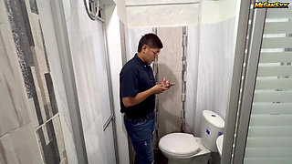 Teacher his student in the bathroom.