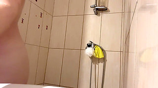 My Stepmom Takes a Shower in Yellow Latex Gloves and Washes Her Body with Lots of White Foam