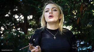 Hot Blonde Babe Smoking Two Black Cigarettes in Nature