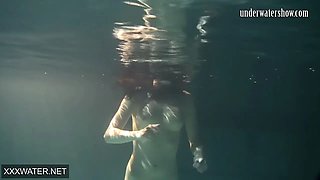 Shaved brunette sissy Irina Polcharova naked in the pool
