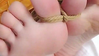 First-person Perspective Records the Girlfriend Wrapped in Tape From Head to Toe with Her Beautiful Bare Feet