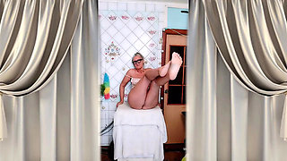 Lukerya is flirting in the kitchen at home.