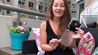Funny brown haired girl in dark-hued top on balcony