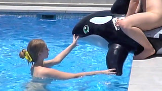 Lesbian Girls Are Having Fun in a Pool with an Inflatable Shark