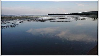 Unstripping On Beach Of Volga-river
