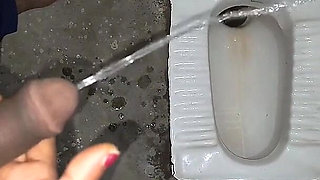 Desi Bhabhi Holding Stepbrother-in-law's Penis and Making Him Pee and Peeing Herself