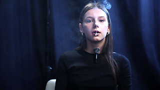 Young Girl Smoking Solo in a Calm Studio Session with Slow Exhales