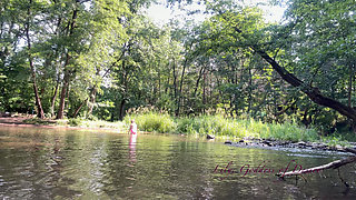 Cute Teen in Costume Playing in the River Like in a Swimming Pool