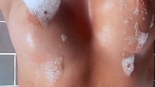 Amateur bikini clad babe oils up her big ass outdoors