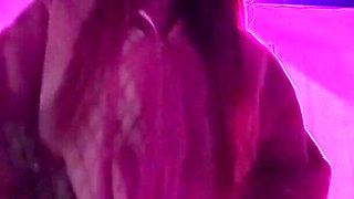 Smoking a Cigarette Outdoor While Wearing Only a Bikini and a Jacket