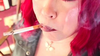 Your Mistress Tina Snua dressed In Leather Chain Smoking 2 Cork Cigarettes