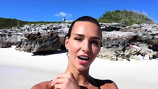 Stunning bikini babe poses for photoshoot on the beach