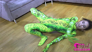 Spineless Lady in Shiny Green Catsuit