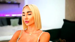 Blonde mature with big boobs masturbates in bed