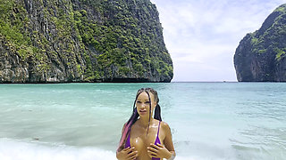 Sexy Monika Fox in Purple Swimsuit on Paradise Island