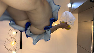 The Juggler Girl Is Here in a Long College Type Uniform Skirt to Flash Her Panties Under Her Miniskirt in the Kitchen