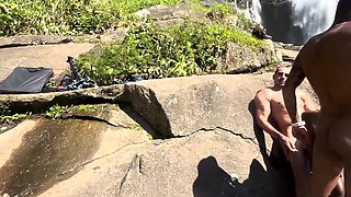 Black hottie got her holes busy with two cocks on a waterfall