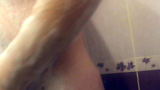 Close-up wife spies on a friend in the shower and sucks swallows cum