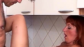 Ginger MILF with hairy pussy lets husband fuck her in the kitchen