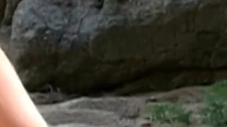 Horny couple fucking on the end of a beach