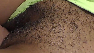 Close-up of a black hairy cunt filled with hot jizz