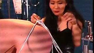 Asian Mistress ties up her slave