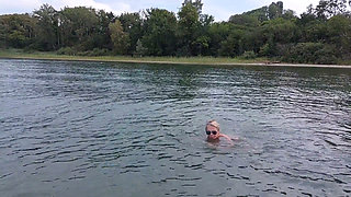 Sexy Granny Swims Naked in a Lake!