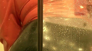 Sexy MILF in latex rubber - Shower striptease