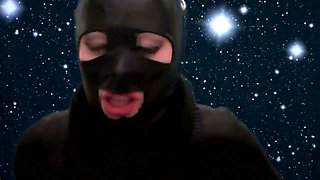 Smoking and teasing you in a latex mask