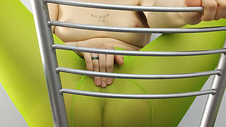 Redhead Teen Feeling Horny in Green Tights on Chair