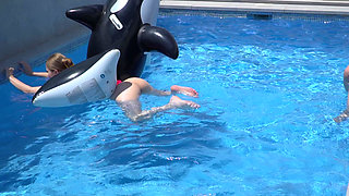 Lesbian Girls Are Having Fun in a Pool with an Inflatable Shark