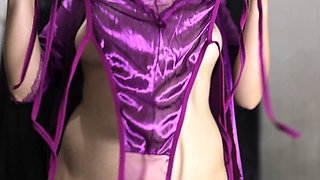 A YOUNG GIRL WEARING A PAIR OF SCARLET LINGERIE AND A PAIR OF SCISSORS