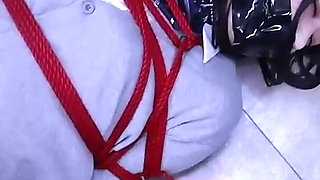 The Lovely Girlfriend Is Bound by Gloves, a Collar, and a Gag